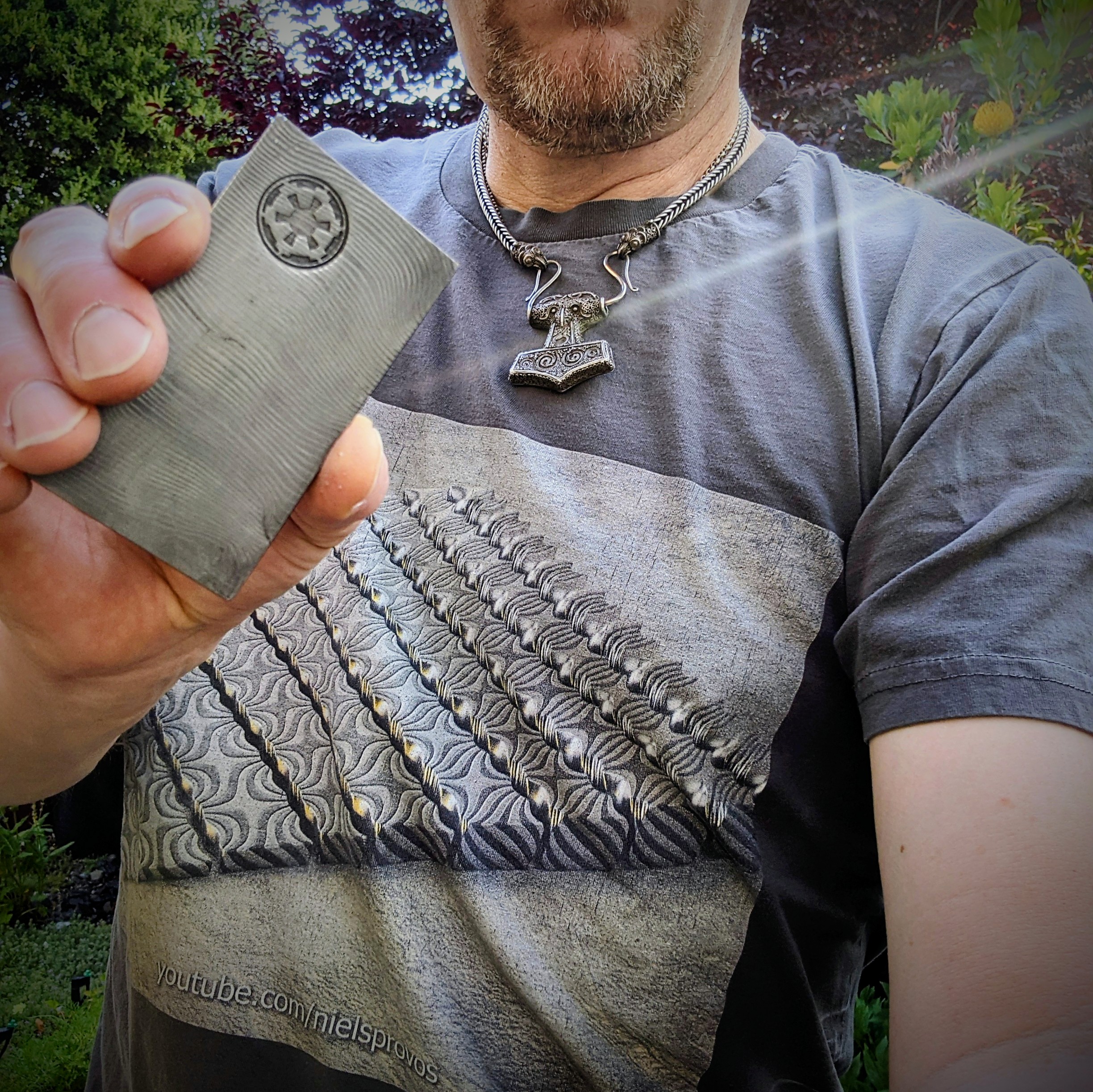 A completed Beskar ingot with Galactic Empire sigil stamped into it